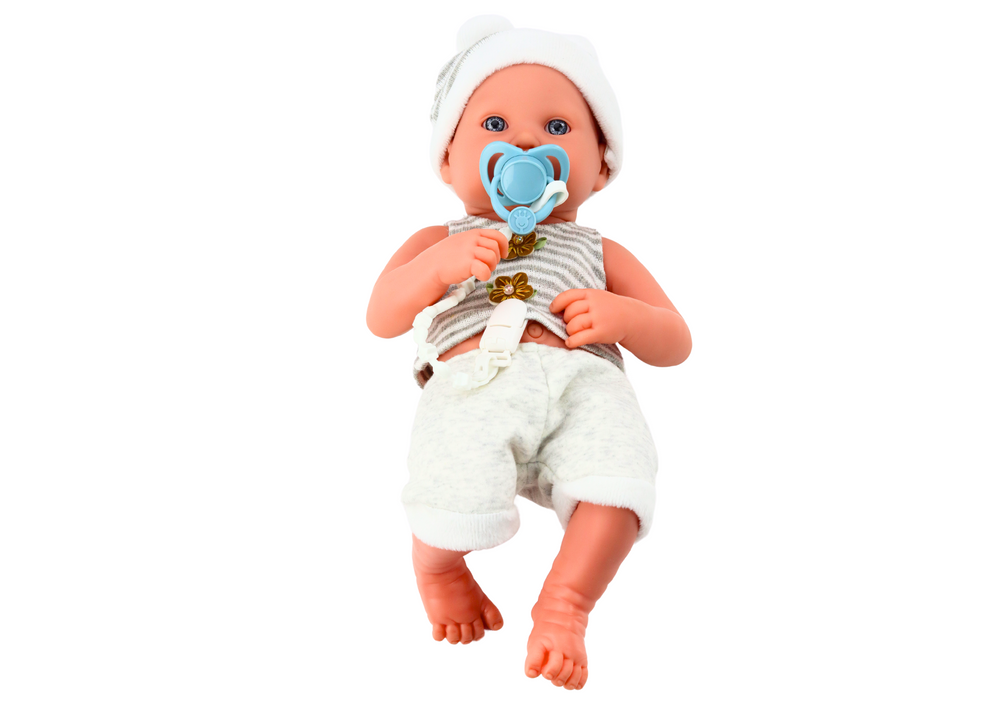 Baby Doll In White And Gray Clothes Hat Pacifier And Blanket