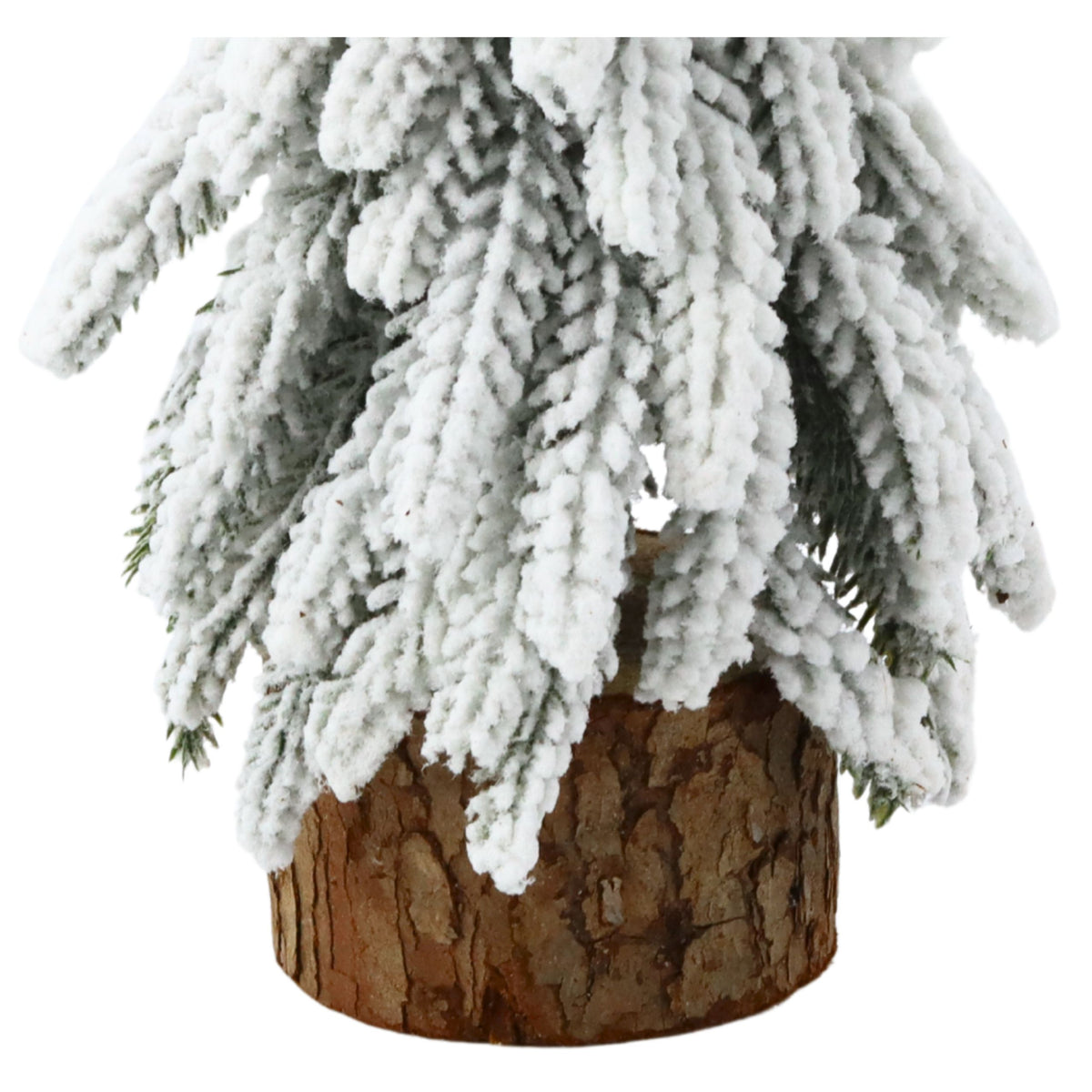 Dekoratív mesterséges karácsonyfa egy hóval borított törzsön 20 x 9 cm