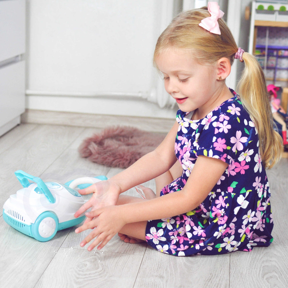 Aspirapolvere interattivo Woopie per bambini con funzione di aspirazione