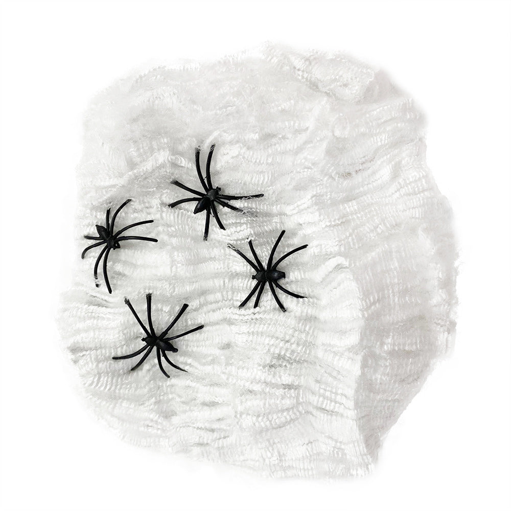Telaraña con arañas blancas