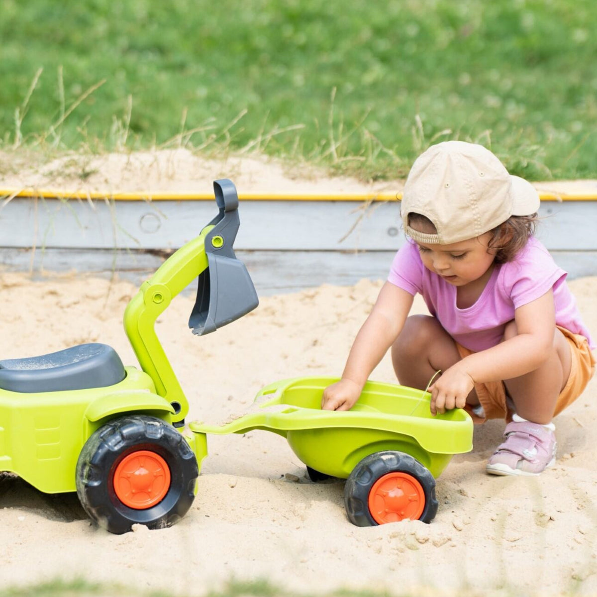 Falk Claas Aufsitztraktor mit Anhängerlader und Schaufel