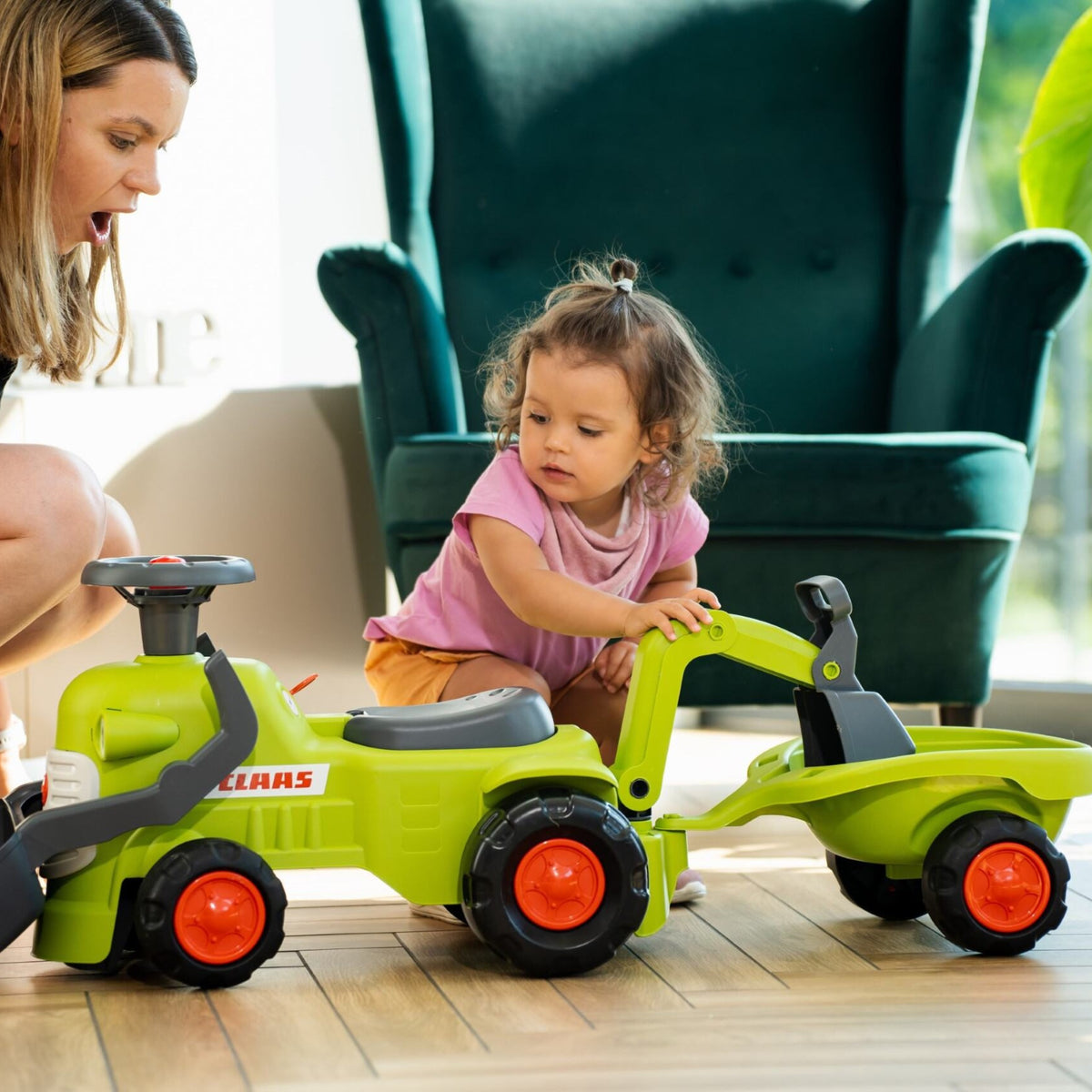 Falk Claas Aufsitztraktor mit Anhängerlader und Schaufel