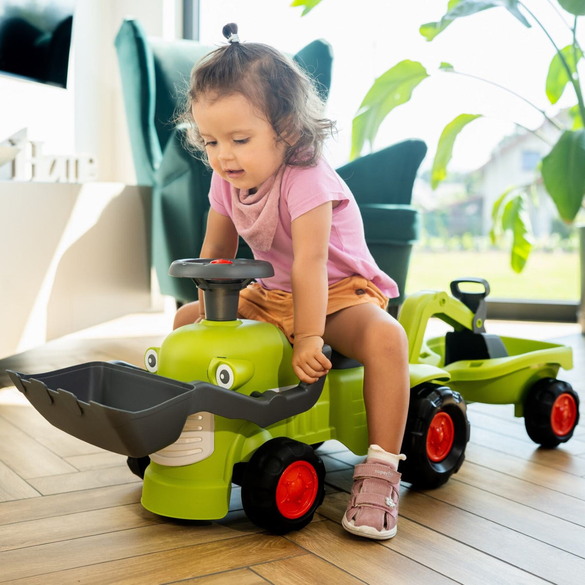 Falk Claas Aufsitztraktor mit Anhängerlader und Schaufel
