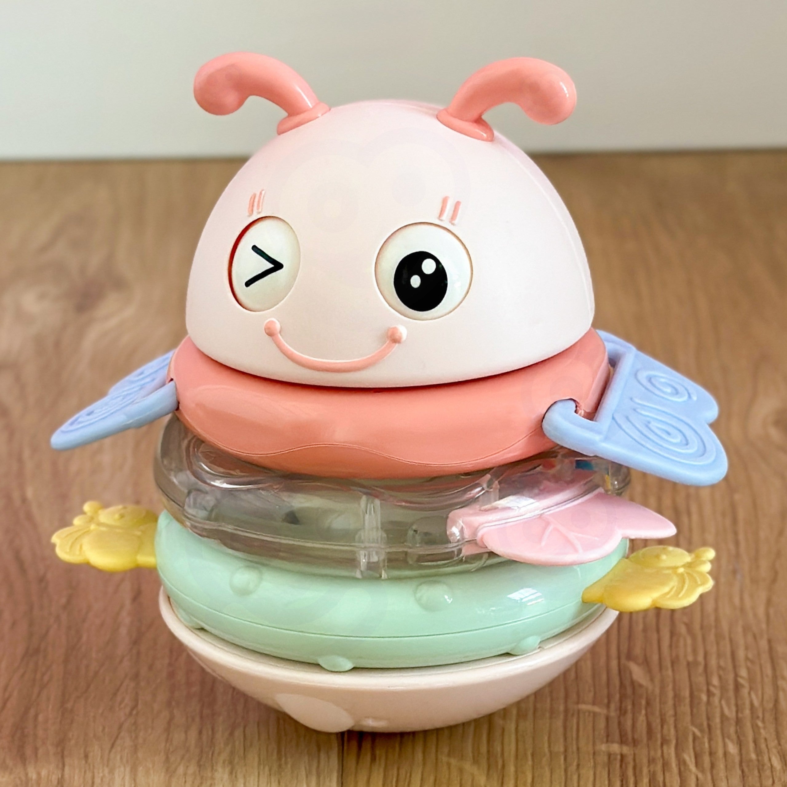 Woopie Baby Wanka Stand Up Sensory Toy 2 i 1 Rattle Teether Rosa